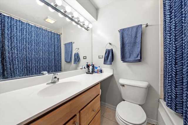 full bathroom featuring tile patterned floors, toilet, vanity, and baseboards