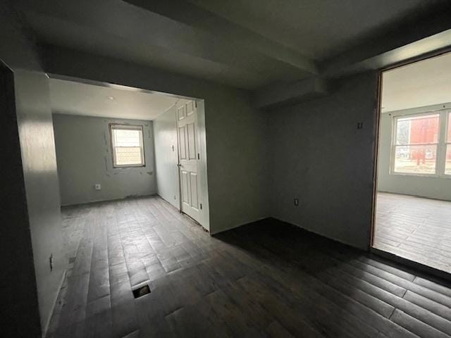 unfurnished room with wood finished floors