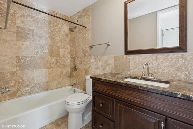 345 W Fullerton Pkwy Unit 1006, Chicago, IL 60614 - bathroom featuring tasteful backsplash, tile walls, toilet,  shower combination, and vanity