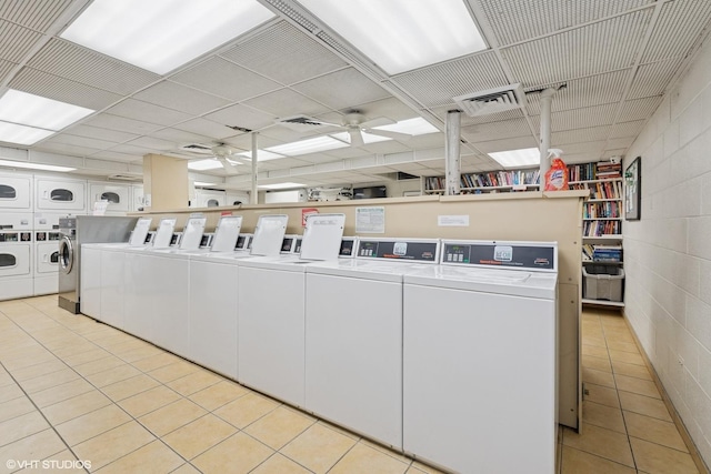 345 W Fullerton Pkwy Unit 1006, Chicago, IL 60614 - shared laundry area featuring ceiling fan, independent washer and dryer, visible vents, light tile patterned flooring, and concrete block wall