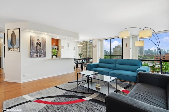 345 W Fullerton Pkwy Unit 1006, Chicago, IL 60614 - living area featuring a city view, baseboards, wood finished floors, and a healthy amount of sunlight