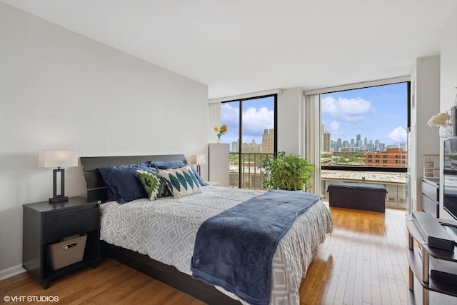 345 W Fullerton Pkwy Unit 1006, Chicago, IL 60614 - bedroom featuring access to outside, wood finished floors, and a wall of windows