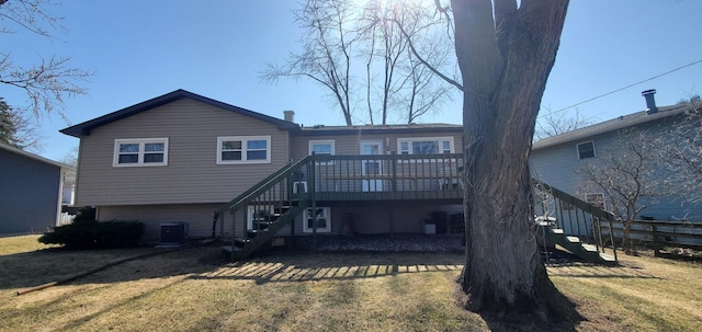 back of property with stairway, a lawn, central AC, and a wooden deck