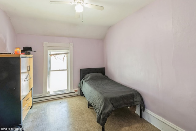 bedroom featuring a ceiling fan, baseboards, a baseboard radiator, vaulted ceiling, and tile patterned floors