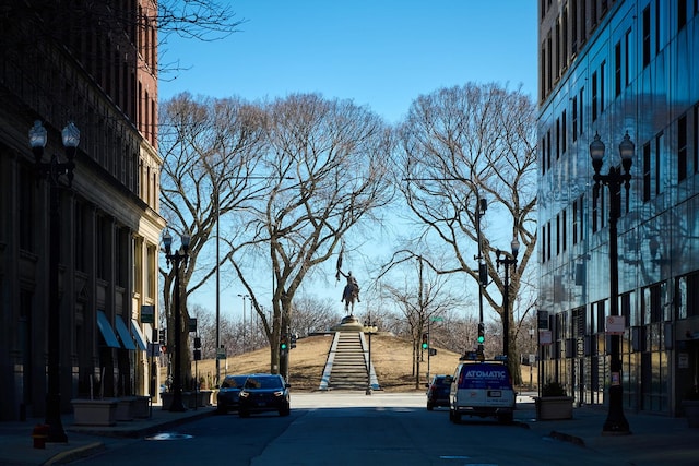 view of street with curbs, street lighting, and sidewalks