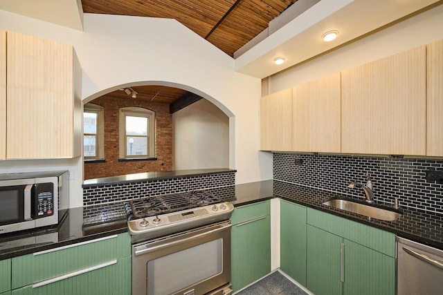 kitchen featuring dark stone countertops, a sink, appliances with stainless steel finishes, wooden ceiling, and tasteful backsplash