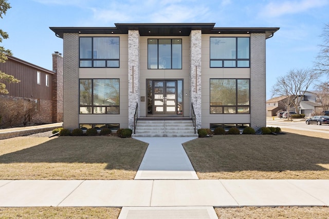 modern home with brick siding and french doors