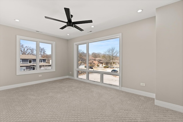 empty room with carpet floors, baseboards, a ceiling fan, and recessed lighting
