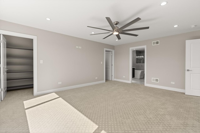 unfurnished bedroom with light colored carpet, visible vents, and recessed lighting