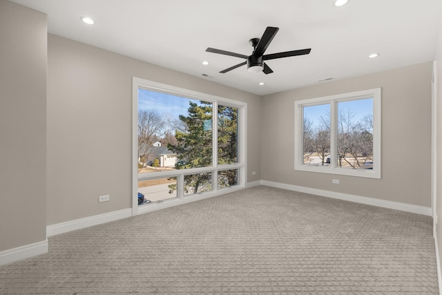 spare room featuring recessed lighting, a ceiling fan, baseboards, and carpet flooring