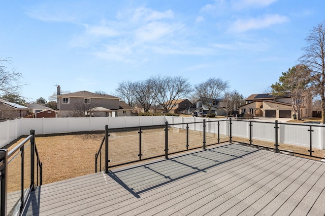 deck featuring a residential view and a fenced backyard