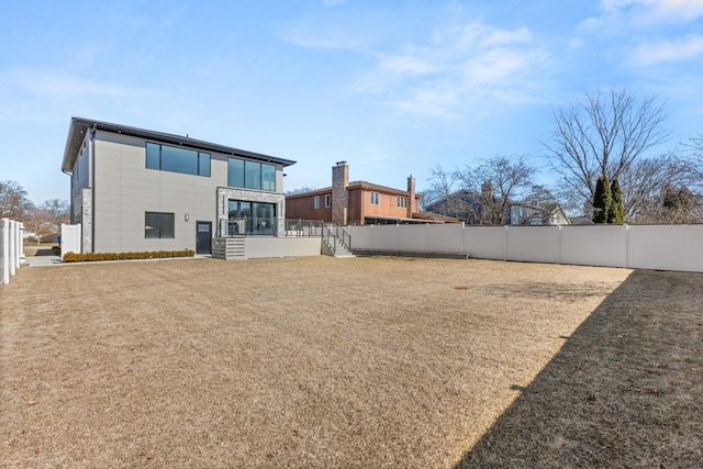 back of property with fence