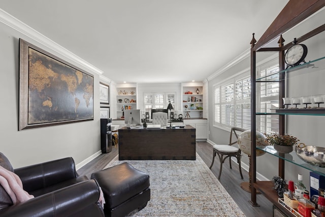 office with built in shelves, dark wood-type flooring, baseboards, and ornamental molding