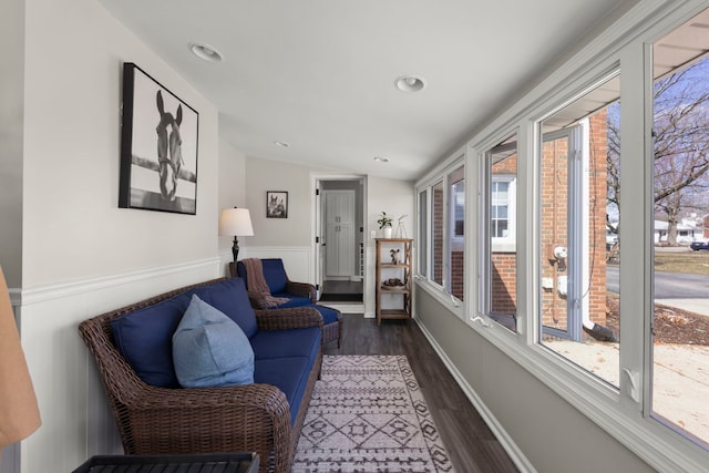 interior space featuring recessed lighting, dark wood-style floors, and vaulted ceiling