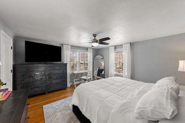 bedroom with a ceiling fan and wood finished floors