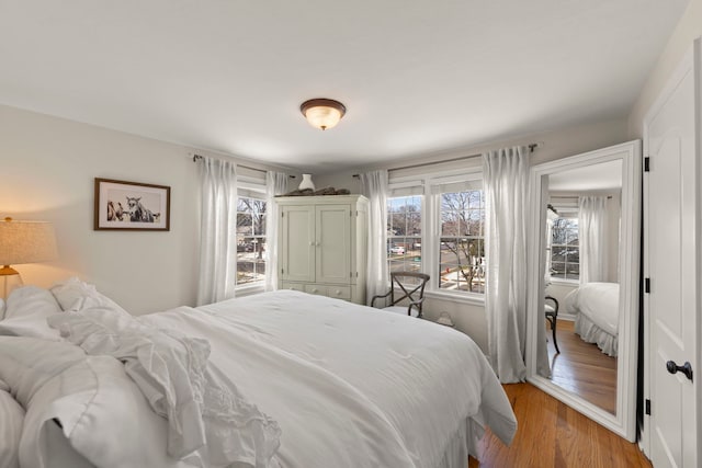 bedroom featuring light wood-style flooring