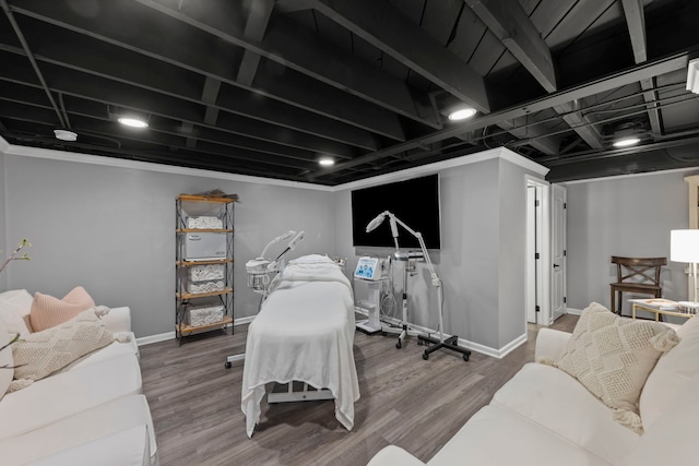 interior space with wood finished floors and baseboards