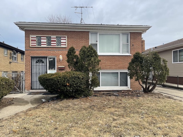 view of front of property featuring brick siding