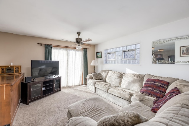 living area featuring ceiling fan and carpet flooring