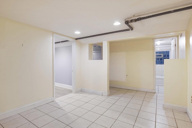 spare room with light tile patterned floors, recessed lighting, and baseboards