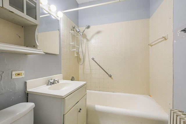 bathroom featuring bathing tub / shower combination, toilet, and vanity