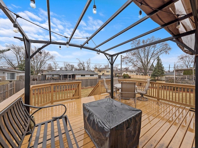 wooden terrace with a pergola, a fenced backyard, and a residential view