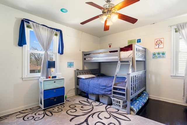 bedroom with baseboards and ceiling fan