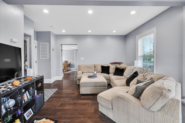 living room featuring recessed lighting, baseboards, and wood finished floors