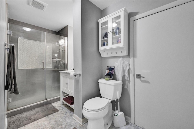 bathroom with visible vents, a stall shower, toilet, and baseboards