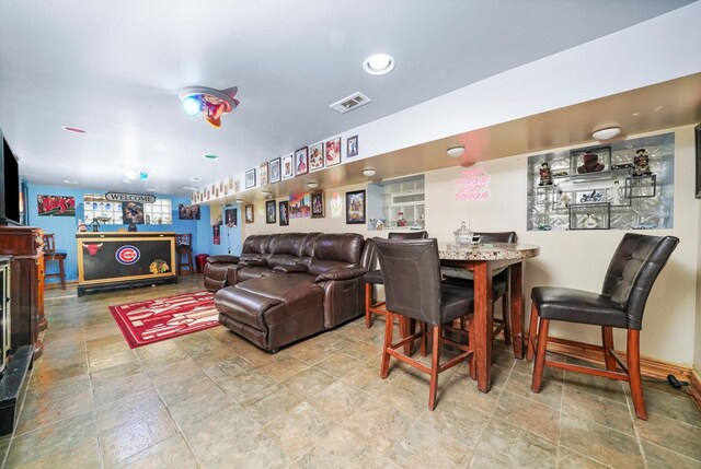 1418 N Mayfield Ave, Chicago, IL 60651 - living area featuring stone finish floors and bar