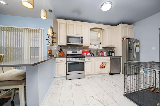 1418 N Mayfield Ave, Chicago, IL 60651 - kitchen featuring stainless steel appliances, a peninsula, dark countertops, and light marble finish flooring
