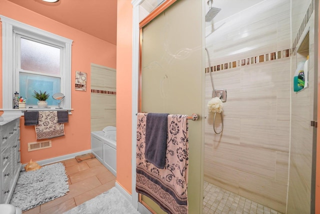 1418 N Mayfield Ave, Chicago, IL 60651 - bathroom featuring tile patterned flooring, a tile shower, vanity, and a garden tub
