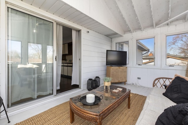 living room with beam ceiling