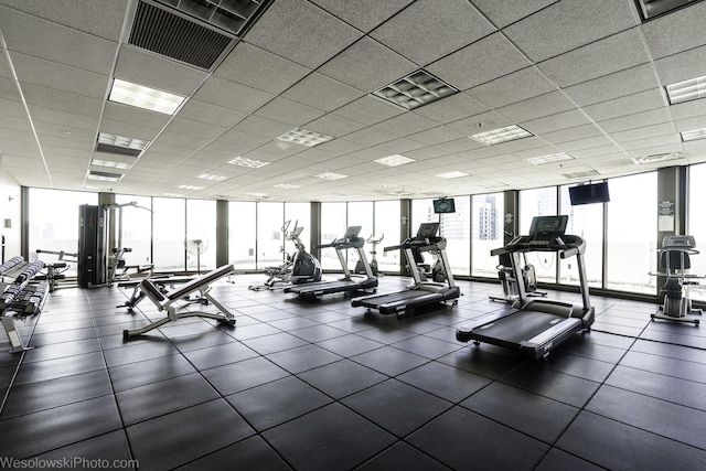 gym with plenty of natural light and expansive windows