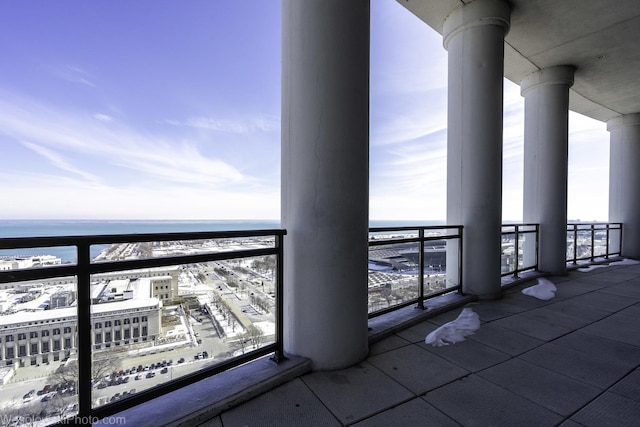 balcony featuring a water view