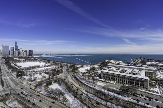 birds eye view of property with a city view and a water view