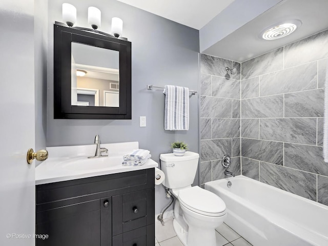 bathroom with tile patterned floors, visible vents, toilet, bathing tub / shower combination, and vanity