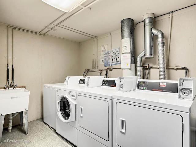 shared laundry area with washer and clothes dryer