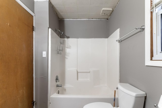 full bath with visible vents, toilet, and shower / bathtub combination