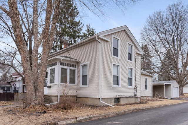 view of property exterior featuring a garage