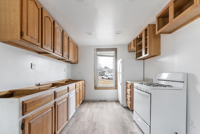 kitchen with light wood-type flooring, open shelves, white gas range oven, brown cabinetry, and baseboards