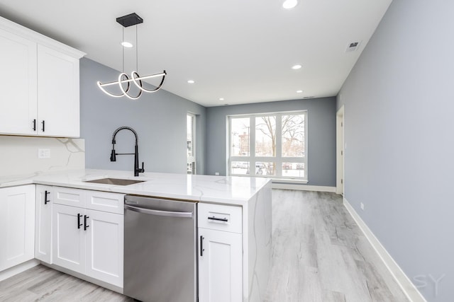 kitchen with visible vents, light stone countertops, dishwasher, a peninsula, and a sink