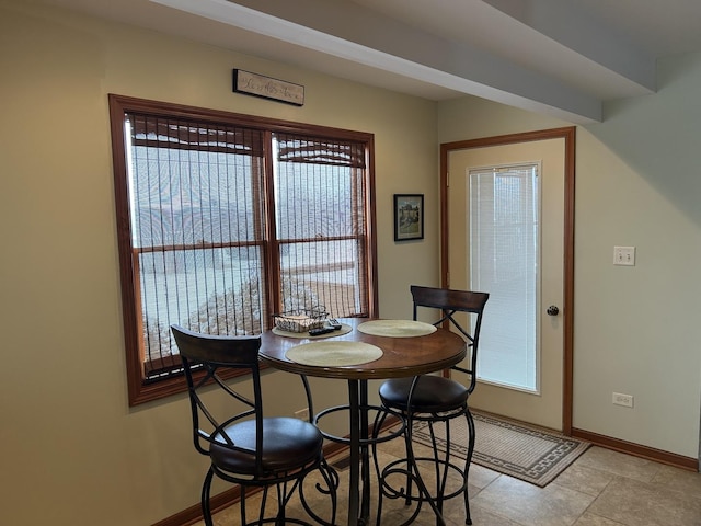 dining area featuring baseboards