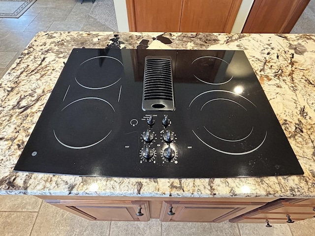 details featuring light countertops and black electric cooktop