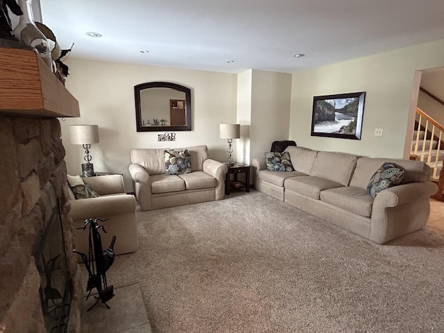 living area with stairway and carpet flooring