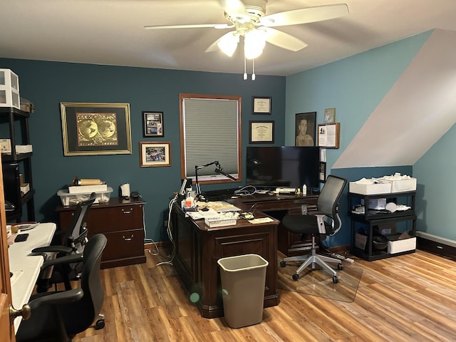 office space with baseboards, a ceiling fan, and wood finished floors