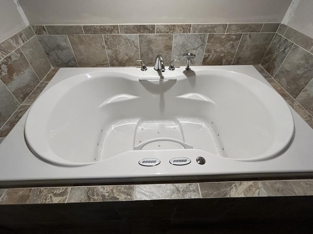 interior details featuring a whirlpool tub