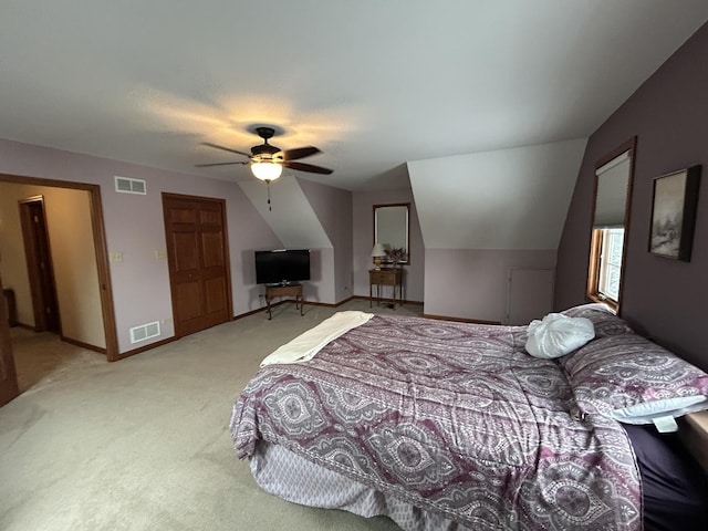 bedroom featuring light carpet, visible vents, a ceiling fan, and baseboards