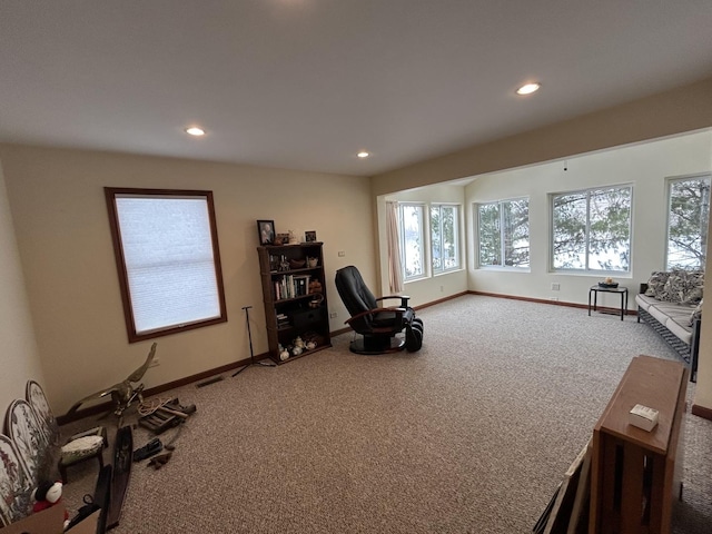 living area with recessed lighting, baseboards, and carpet