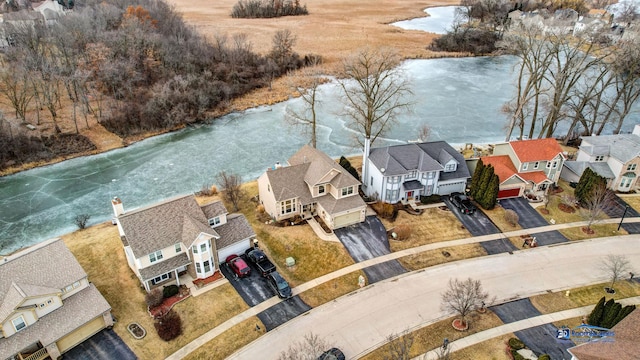 birds eye view of property featuring a residential view and a water view